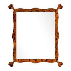 an animal print frame mirror with tassels on the edges and a white background