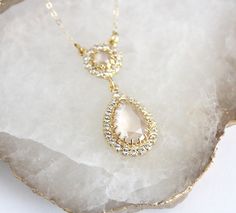 "Our Crystal Bridal necklace with Ivory cream surrounded by clear crystals. A delicate teardrop wedding pendant necklace. Also perfect for your bridesmaids! - Handmade to order with CRYSTALLIZED™ - Swarovski Elements - Swarovski Ivory cream and clear stones - 18K gold plated brass - Gold filled chain - Necklace measures 16\" and extends to 18\" - Available in other finishes and Swarovski crystals upon request - Pendant measures 1.5\" x 5/8\" - Each piece is gift wrapped Please see Swarovski colo Bridal Necklace Gold, Gold Wedding Necklace, Necklace For Bride, Bride Wedding Jewelry, Cream Necklace, Gold Necklace Wedding, Gold Bridal Necklace, Cream Earrings, Ivory Earrings