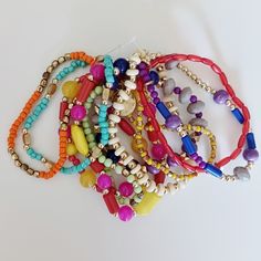 Layered Multicolored Stretchy Bracelets Colorful Beads Wear Together Or Separate Multicolor Wooden Beads Jewelry For Party, Multicolor Wooden Beaded Necklaces For Party, Multicolor Wooden Beads Necklace For Party, Trendy Red Beaded Bracelets For Festival, Multicolor Multi-strand Beaded Bracelets For Beach, Vibrant Round Beads Bracelets For Beach, Vibrant Colorful Beaded Bracelets For Summer, Trendy Red Bracelets With Colorful Beads, Multicolor Multi-strand Beaded Bracelets For Party