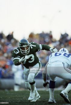 a football player running with the ball during a game