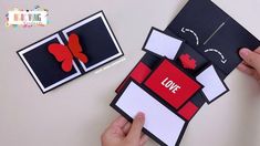 someone is making a card out of paper