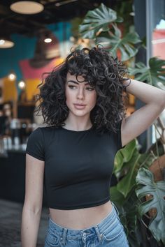 Embrace the fierce vibe of baddie energy with this fabulous medium-length curly hairstyle. Featuring voluminous, luscious curls and flowing layers that frame the face, this look radiates confidence and style. Perfect for any occasion, enhance it with some playful bangs or a half up half down style for that effortless yet polished finish. #curlyhairstyles Curly Cuts With Layers Medium, Curly Cuts With Layers, Curly Hair And Glasses, Baddie Energy, Hair And Glasses, Curly Cuts, Growing Out Hair, Layers Medium, Medium Length Curly Hair