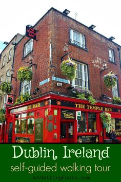 there is a red building with plants on the top and below it that says dublin ireland self - guided walking tour