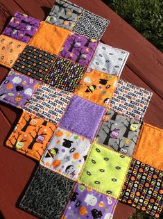 a patchwork table runner made with halloween fabric