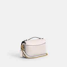 Our structured Cassie crossbody has classic good looks and ample room to hold everyday essentials with three organized compartments. A more compact version of the original the 17 is crafted of refined pebble leather and finished with our iconic turnlock closure. Style the versatile bag three ways: carry by hand with the ladylike top handle wear on the shoulder with the elegant chain strap or crossbody with the adjustable leather strap. | Coach Cassie Crossbody Bag 17 - Women's Designer Crossbody Classic Crossbody Bags For Everyday Luxury, Classic Coach Saddle Bag With Removable Pouch, Versatile Coach Bag With Gold-tone Hardware, Classic Flap Bag With Adjustable Strap For Everyday Luxury, Classic Luxury Flap Bag With Adjustable Strap, Classic Coach Bags With Smooth Grain, Elegant Coach Pebbled Leather Satchel, Classic Coach Daily Flap Bag, Classic Coach Flap Bag