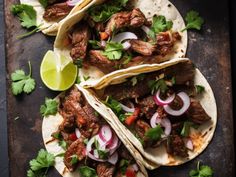 three tacos with meat, onions and cilantro