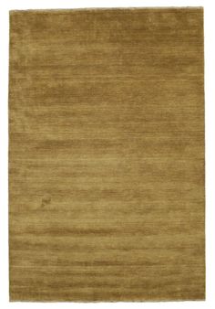 a brown rug on a white background with no one in the room to see it