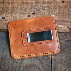 The "Riley" wallet is a must-have for anyone who wants to keep their things organized. It's made from world-famous Horween leather which makes it strong and good-looking. The leather will change color over time and look even better.On the front of the wallet, there are two pockets to put your cards in and a little pocket on top for extra cards. You can put your ID, credit cards, and business cards in these pockets. And the pockets can hold more cards as you use the wallet more.The money clip on Rectangular Wallet With Interior Card Slots For Everyday, Everyday Rectangular Wallet With Interior Card Slots, Rectangular Wallets With Leather Patch For Everyday Use, Rectangular Wallets With Leather Lining For Everyday Carry, Rectangular Leather Trifold Wallet For Everyday Use, Leather Bifold Coin Purse For Everyday Use, Rfid Blocking Everyday Rectangular Wallet, Bifold Card Holder With Leather Patch For Everyday Use, Rectangular Wallets With Card Slots For Everyday