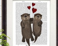 two otters holding each other's hands with hearts floating above them on an old book page