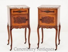 two wooden nightstands with marble top tops