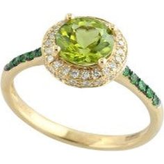 Dive into the magical elegance with this splendid 14K yellow gold peridot halo ring. Imagine yourself adorned with a piece that captures the essence of an enchanted forest, where the vibrant green peridot at its heart sparkles like a dewdrop kissed by the first rays of dawn. This round-cut peridot, weighing a dazzling 1.50 carats, is embraced by a halo of twinkling diamonds totaling 0.18 carats, adding a touch of celestial brilliance to the earthly charm of the center stone.As if that weren’t enchanting enough, the band is elegantly adorned with tsavorites, their rich green hues perfectly complementing the peridot and creating a harmonious blend of nature's finest colors. Each tsavorite is meticulously set in the 14K yellow gold band, adding a subtle yet striking contrast that enhances the Nature Inspired Rings, Diamond Birthstone, Gold Gemstone Ring, Green Hues, Luxury Rings, Yellow Gold Setting, Rich Green, Peridot Ring, Green Peridot