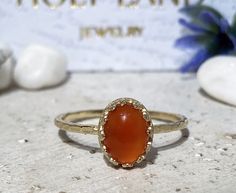 Don't miss this opportunity to own this beautiful gemstone ring crafted in 14k gold filled => Gemstone Type - Carnelian => Gemstone Size - 6*8 mm => Gemstone Cut - Cabochon => Metal Type - 14k Gold Filled (Tarnish Resistant And Nickel Free) - also available in 925 sterling silver * Please contact me for pricing on a sizes larger than 11 * ~ Feel free to ask me about custom made designs. ❏ Replacements and custom orders : ✪ 925 sterling silver - no additional cost ✪ 14k rose gold fill Handmade Oval Yellow Gold Stackable Rings, Handmade 14k Gold Oval Rings, Oval Carnelian Moonstone Ring For Anniversary, Handmade Oval Moonstone Ring In 14k Gold, Handmade 14k Gold Oval Moonstone Ring, Oval Carnelian Jewelry For Anniversary, Carnelian Oval Jewelry For Anniversary, Untreated 14k Gold Oval Ring, Oval Untreated 14k Gold Ring