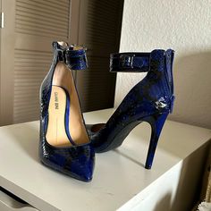 Brand New Never Worn Heels. Blue Snake Skin, Zip Up Back Chic Blue Ankle Strap Heels, Chic Blue Heels With Heel Strap, Blue Ankle Strap Heels For Evening, Blue High Heel Shoes With Heel Strap, Blue High Heels With 4-inch Heel, Blue High Heels With Heel Strap, Chic Blue Pointed Toe Heels, Blue Heels With 4-inch Heel For Night Out, Blue Pointed Toe Heels For Night Out