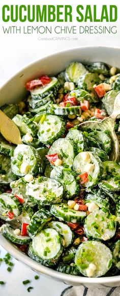 cucumber salad with lemon chive dressing in a white bowl on a table