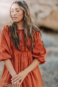 The Nayvee Dress is a flirty and flowy 100% cotton dress with polyester lining and embroidered lace details. The stunning rust orange color is sure to turn heads. Complete the look with the included neck tie. Embrace your free-spirited style in this beautiful dress! 100 Cotton, Lining 100 Polyester Model Measurements: Hips 37” Waist 27” 33”, Height 5’6, wearing a size small Measurements S: Bust 36” | Waist 34” | Hips 42” | Length 33” M: Bust 37” | Waist 35” | Hips 44” | Length 34” L: Bust 38” | Bridesmaid Tops, Blessing Dress, Temple Dress, Free Spirit Style, Boho Style Dresses, Rust Orange, Free Spirited, Romper Pants, New Arrival Dress