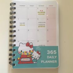 a hello kitty planner is shown on a table