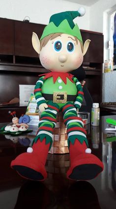 a elf doll sitting on top of a table