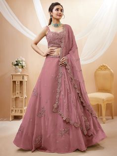 Upgrade your ethnic wardrobe with this stunning designer dusty pink sequin georgette party wear lehenga choli. Crafted with meticulous attention to detail, this ensemble exudes elegance and charm, making it perfect for receptions, weddings, and parties.
The lehenga features a beautiful dusty pink color, which is complemented by intricate dori work, glitter sequin work, and embroidery work. The georgette material adds a touch of luxury and grace to the outfit. With a semi-stitched design and a 3. Linen Lehenga, Simple Lehenga Designs Classy, Unique Lehenga Designs, Dori Work, Georgette Material, Simple Lehenga, Choli Dress, Indian Lehenga Choli, Outfits Indian