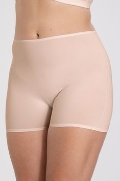 Shorty panty in minimalistic clean design boxer style. A style suitable for all ages.  Soft and comfortable material made from recycled textile fibre. This style has a high waist and short legs. Perfect whenever you need full coverage. A garment that stays in place and won't loose shape nor slip.  The material used is thicker and more stable than in our Basic range with micro fibre feel. Smooth material ensures that clothes move won't "stick" during movement. Flatlock-seam at waist and hem at le Solid Color Smoothing High-waisted Shorts, Seamless High-waisted Shorts Shapewear, Seamless High-waisted Shapewear Shorts, Stretch Shapewear Shorts With Soft Touch, Compressive Solid Color Shorts With Soft Touch, Compressive Seamless Beige Shorts, Shapewear Bottoms With Soft Touch, Short Shapewear Bottoms With Soft Touch, Solid Color Shapewear Shorts With Soft Touch