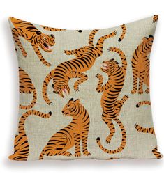 an orange and black pillow with tigers on it