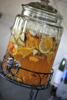 a glass jar filled with liquid sitting on top of a metal rack