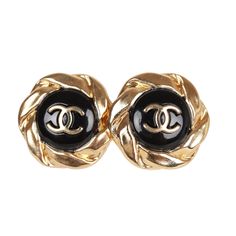 These 22A Chanel stud earrings are in the signature CC logo with a sunburst design, and are gold tone with a black enamel contrast background. Origin: France Condition: New and never worn Accompanied by: Chanel box and pouch Measurements: 1" x 0.6" Designer Black Clip-on Earrings, Designer Black Round Earrings, Designer Black Clip-on Jewelry, Luxury Black Round Earrings, Luxury Black Round Clip-on Earrings, Designer Black Earrings For Gift, Luxury Black Clip-on Earrings For Formal Occasions, Contrast Background, Chanel Stud Earrings