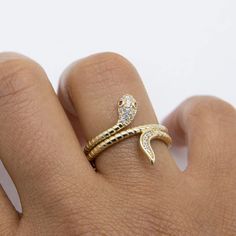 "3/4\" CZ Snake with Pink Eyes Ring Solid Real 10K Yellow Gold Size 7.5 * Metal : Real 10K Yellow Gold (Properly Stamped, 10K)  * Condition : Brand New  * Finish : Polished  * Average Weight : 3.76 grams  * Length : Size 7.5  * Width : 19mm x 5mm = 3/4\" x 3/16\"  * Clasp/Bail : Can be resized down or up at your local jeweler. All of our items are brand new and are shipped with a gift box." Gold Snake Ring With Diamond Accents As Gift, Gold Snake Ring With Diamond Accents For Gift, Gold Snake Ring With Diamond Accents For Anniversary, Gold Snake Ring With Diamond Accents, Adjustable 14k Gold Snake Ring For Anniversary, Eyes Ring, Snake Ring Gold, Cats Eye Ring, Serpent Ring