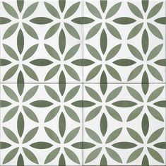 an artistic tile design in green and white with leaves on the tiles, as well as circles