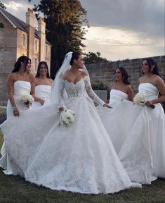 the brides are all dressed in white dresses