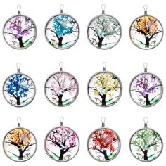 six different colored tree ornaments hanging from a silver plated chain on a white background