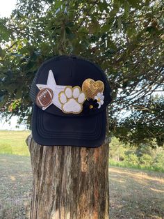 ❤️Create your own custom sports trucker hat. Choose your sport, colors, number or initials (minimum of 2 numbers or letters). ❤️ Please message us before purchasing to ensure that we have the patches that you want. Once we have discussed details just purchase the listing and leave the major details in the personalization box at checkout. I will send pictures in Etsy messages for your approval before we press the hat. We will work together to make sure that we have created a hat that you will love!  ❤️Hats will include 3-4 medium patches (hearts, stars, paw prints, tiger heads, numbers, letters, sports patches) and 1-2 smaller patches for fillers (hearts, flowers, stars, lightning bolts, butterflies, etc.) Hats chains are also available for an additional charge.  ❤️Free Shipping on orders o One Size Trucker Hat With Visor For Sports Events, Sports Fan Trucker Hat With Visor For Events, Customizable Sporty Cap, Adjustable Customizable Sports Fan Hat, Customizable Black Hats For Baseball Season, Personalized Snapback Hats For Sports Events, Customizable Trucker Hat With Curved Brim For Sports Events, Customizable Black Sports Hat, Personalized Sports Cap