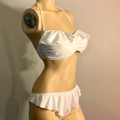 Sexy Bikini Set By Jessica Simpson Features A Unique And Flattering Ruffle Front Moderate Coverage Back Bikini Brief And A Ruffled Strapless Bra With Pads And Optional Halter Strap. New In Package Retail$92 2 Sets 1-L 1-L Top M Bottom White Bandeau Swimwear With Built-in Bra, Fitted Underwire Swimwear With Ruffles, Fitted Underwire Ruffle Swimwear, Fitted Ruffled Underwire Swimwear, White Strapless Tankini, Chic Strapless Ruffled Swimwear, Flirty Party Swimwear With Ruffles, White Underwire Tankini With Lined Body, White Ruffled Tankini For Swimming