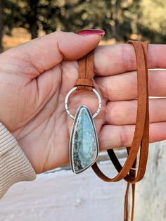 Combining three of my favorite materials! Silver, Stone & Leather :) This unique necklace features a beautiful ombre green-grey stone, anchored in solid Sterling Silver.  The necklace is fully adjustable, wear it short, choker style, or very long low-chest level, or anywhere in between!  Adjust simply by moving the silver slider. All the metal on the necklace is solid Sterling Silver and forged by hand, and features hand stamped and oxidized designs. The leather is genuine, super soft Deerskin leather, in a warm brown.  This leather is buttery smooth and feels amazing against your skin! This necklace is a large statement style piece, but it is lightweight, for all day comfort.  This will look beautiful with all your western or boho outfits.   The last four photos show more of my hand forge Artisan Lariat Jewelry With Adjustable Cord, Adjustable Jewelry With Natural Stones For Everyday, Handmade Adjustable Moss Agate Necklace, Adjustable Artisan Moss Agate Jewelry, Adjustable Moss Agate Artisan Jewelry, Bohemian Necklace With Large Adjustable Stone, Adjustable Moss Agate Gemstone Jewelry, Bohemian Hand Forged Adjustable Necklaces, Bohemian Adjustable Hand Forged Necklaces