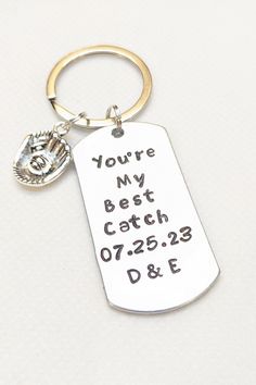 a keychain with the words you're my best catch and date engraved on it