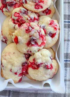 four strawberry muffins sitting on a red plate