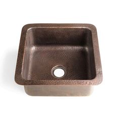 a square copper sink with a single hole in the middle and a metal faucet