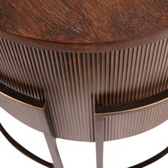 a close up view of a wooden table with curved metal bars on the top and bottom