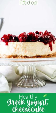 healthy greek yogurt cheesecake on a cake plate with the title above it