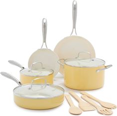 yellow pots and pans with wooden utensils