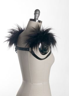 This chest harness with faux fur shoulder detail adds instant gothic drama and impact to any outfit. This piece works especially well with dresses and flowing tops that don't have a defined waistline, or paired with a corset. Buckles in front across chest. Silver toned nickel-plated steel hardware. Shown in black leather. Also available in PVC. All colors have black faux fur except white PVC, which has white faux fur.All pieces are MADE TO ORDER, standard sizes XS-4XL. If your measurements fall Shoulder Harness, Chest Harness, Black Pvc, Leather Harness, White Faux Fur, Black Faux Fur, Make Time, Custom Fit, Leather Handmade