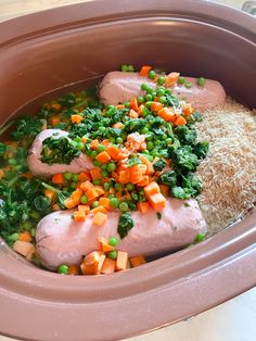 a bowl filled with rice, meat and veggies next to a side dish