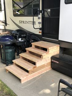 the stairs are made out of wood for people to step up from their motor home