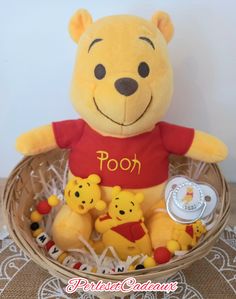 a winnie the pooh stuffed animal in a basket