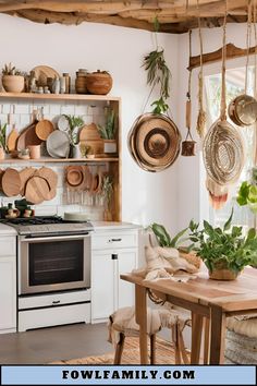 a kitchen with pots and pans hanging from the ceiling, next to an oven