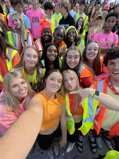 a group of young people standing next to each other