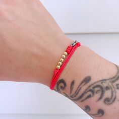 "Red String Surfer Bracelet Good Luck Gold Beads Silver Beads Bracelet Christmas Birthday New Year Gift Waterproof Surfer Beach Bracelet ❤ This item is made of 1mm high-quality red waxed cord with gold-filled beads or sterling silver beads (4mm) and a stainless lobster clasp. It is adjustable, the longest length is 18\", it fits everyone. ❤ It is a bracelet, it is also an anklet. ❤ This bracelet can be worn 24hours, even in the shower. It dries really fast. ❤ According to my testing, this bracel Red Beaded Bracelets With Letter Beads For Birthday, Adjustable Red Bracelet For Birthday, Red Beaded Bracelets For Birthday, Adjustable Gold Beaded Bracelets For Holiday, Beach Bracelet, Good Luck Bracelet, Surfer Bracelets, Bracelet Christmas, Adjustable Knot