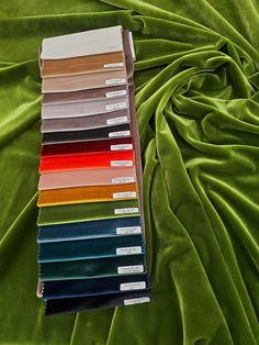 the color swatches are all lined up on top of the green sheeting material