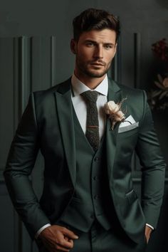 a man wearing a suit and tie with a boutonniere on his lapel