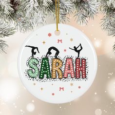 an ornament hanging from a christmas tree with the word sara written on it