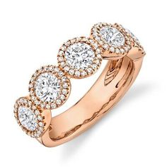 a rose gold ring with three round diamonds